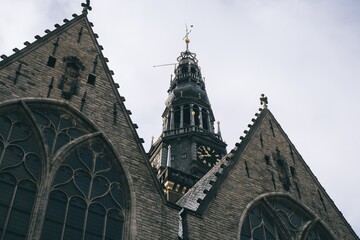 Low angle shot of The Oude Church in Amsterdam, Netherlands