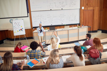 students on a lecture in amphitheater