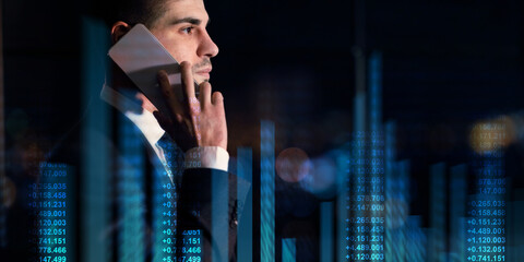 Poster - Young Caucasian entrepreneur talking on smartphone on dark background, collage with finance nimbers and graphs