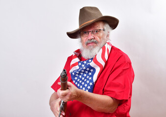 Angry old man, armed with a sawed off rifle, wearing patriotic colors, eyeglasses and a floppy western hat..Go ahead, make my day