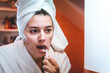 © blanke1973 - a girl in the bathroom pours facial cleansing foam