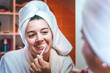 © blanke1973 - a girl in the bathroom pours facial cleansing foam
