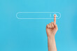 © Snizhana - Finger presses the search button in the search bar on a blue background.