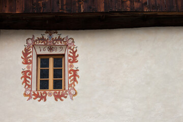 Detail of a traditional balcony from an old house in St. Magdalena in Val di Funes