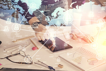 Fototapete - Double exposure of man's hands holding and using a phone and social network theme drawing.