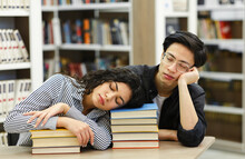 Tired Students Napping In The Public Library