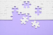 © New Africa - Blank white puzzle pieces on violet background, flat lay