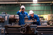© Thirawatana - Engineers and skilled technicians are maintaining machinery. Engineers are working and repairing machines in industrial. Technician holding Measuring pliers. Scale Metal Vernier caliper measuring.