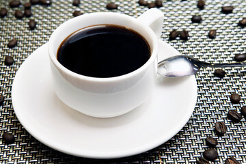 cup of black coffee with beans