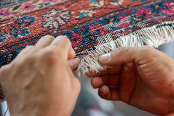 traditional hand sewing fixing old vintage antique persian carpet up close