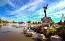 Keeper Of The Plains Sculpture In Dramatic Background In Wichita Kansas