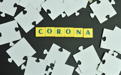 the word CORONA among jig saw puzzle pieces