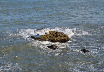 waves crashing on rocks