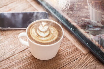 Canvas Print - Coffee cup on a rainy day window background