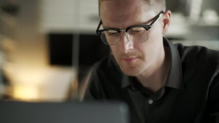 Young Man Freelancer Using Laptop Online Working From Office In Internet, Smiling Focused Millennial Guy Searching On Computer Surfing Web Looking At Screen Enjoying Distant Job