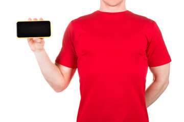 Canvas Print - Man in red t-shirt holding mobile phone on his palm isolated white background