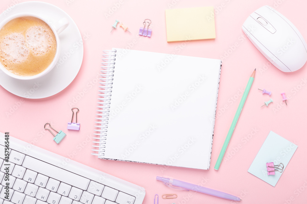 Woman office workplace with cup of coffee, notepad and stationery accessories on pink background. Top view - obrazy, fototapety, plakaty 