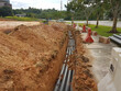 SEREMBAN, MALAYSIA -AUGUST 01, 2019: Underground utility and services pipe laid by workers in the trenches at the construction site. Installation of pipes still ongoing.   