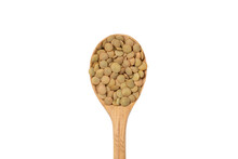 Dry Lentils In A Wooden Spoon Isolated On A White Background. Bean Groats.