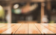 © DEEP PIXEL - Empty wooden table top with lights bokeh on blur restaurant background. You can mock up your product