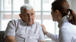 © fizkes - Female doctor comforting upset older patient at meeting, touching shoulder, expressing empathy and support, sad unhappy lonely mature man looking at caregiver close up, elderly healthcare concept