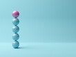 © Shawn Hempel - Pink sphere on stack of blue spheres on blue background, abstract modern minimal success, growth, progress or achievement concept