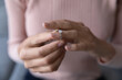 © fizkes - Close up young woman taking off wedding ring, divorce concept, female hands holding engagement ring, cheated girl break up with boyfriend or husband, family split, bad relationship
