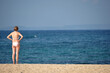 © Bast - Woman enjoying blue sky and beach