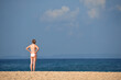 © Bast - Woman enjoying blue sky and beach