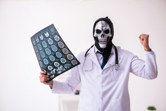 Male devil doctor radiologist working in the clinic