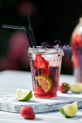 Poster - Delicious refreshing lemonade with basil, lime and strawberries. Summer drink with ice. Home made production.