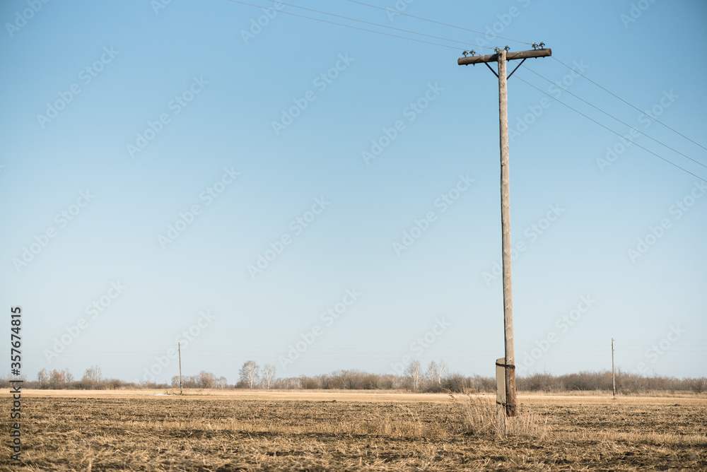 Electric pole of power line on an agricultural field background. Stock ...