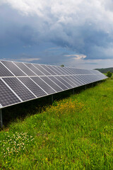 Solar Power Station on the spring flowering Meadow 