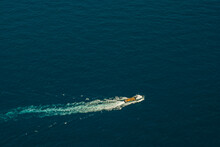 Top View Of A Boat In The Middle Of The Sea.