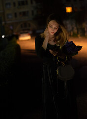 Canvas Print - girl on the street at night in summer