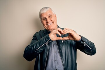 Wall Mural - Senior handsome hoary man wearing casual shirt and jacket over isolated white background smiling in love showing heart symbol and shape with hands. Romantic concept.