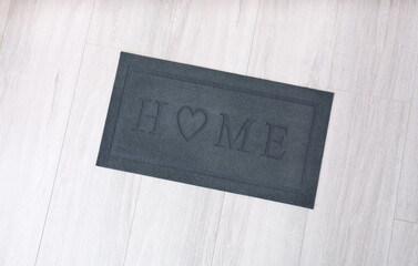 Wall Mural - Door mat on wooden floor