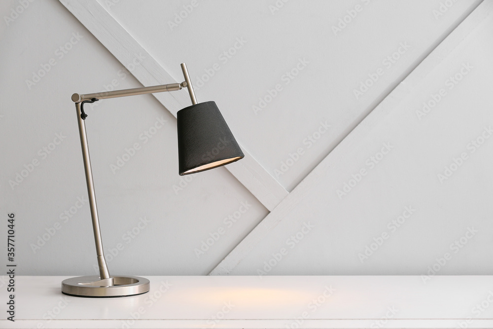 Modern lamp on table in room
