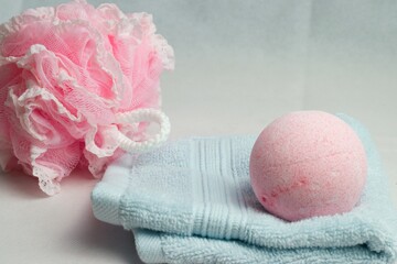 Poster - Closeup shot of a sponge and soap ball on top of a towel