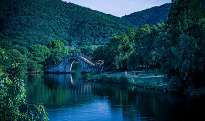 Poster - There is a bridge in the middle of the calm lake