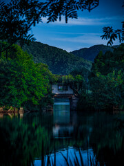 Poster - There is a bridge in the middle of the calm lake