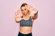 © Krakenimages.com - Young beautiful blonde sportswoman with blue eyes doing exercise wearing sportswear doing frame using hands palms and fingers, camera perspective