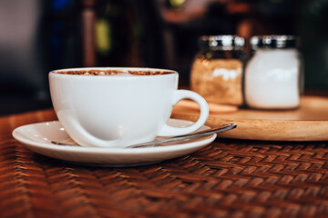 cup of coffee on table in the morning at cafe.