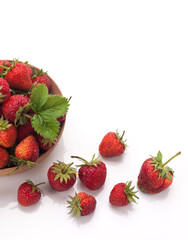 Red fresh strawberry in a bowl isolated on white background