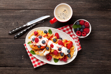 Wall Mural - Delicious belgian waffles with summer berries