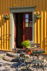 Sticker - Patio with garden furniture by a house