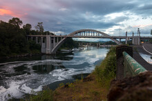 Dramatic Sunset Sky Over Arch Bridge And Willamette River In Oregon City
