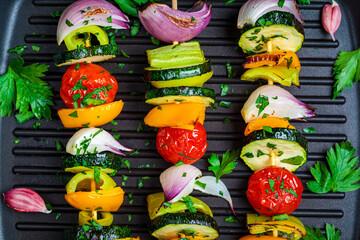 Wall Mural - Grilled vegetable skewers in grill pan, top view. Vegan food concept.