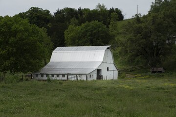 Sticker - View of a barn surrounded by trees