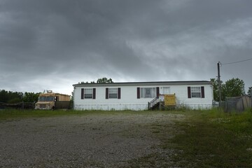 Poster - View of a white house and a truck beside it